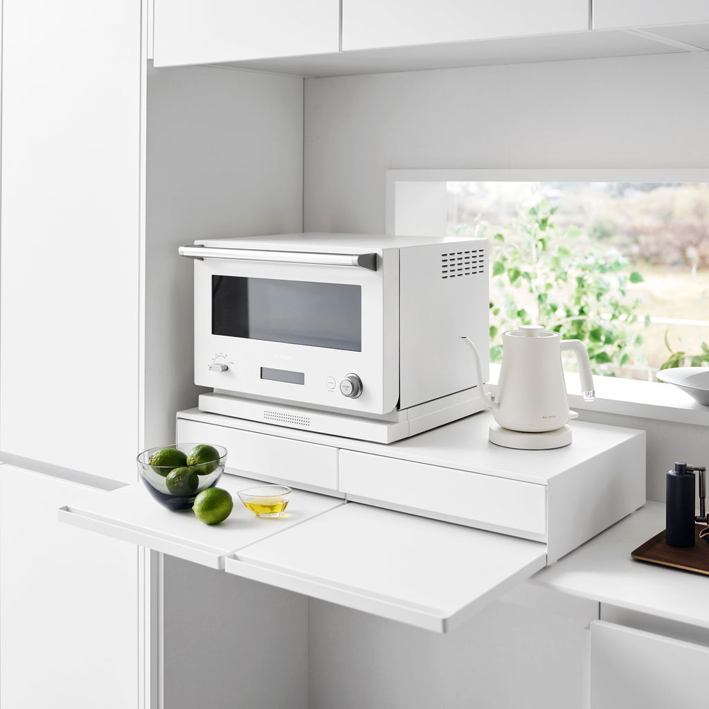 Pull-out shelf can be installed above or below the drawer. The drawer can be pulled out up to 8 inches, while the shelf can be extended up to approximately 9.8 inches.