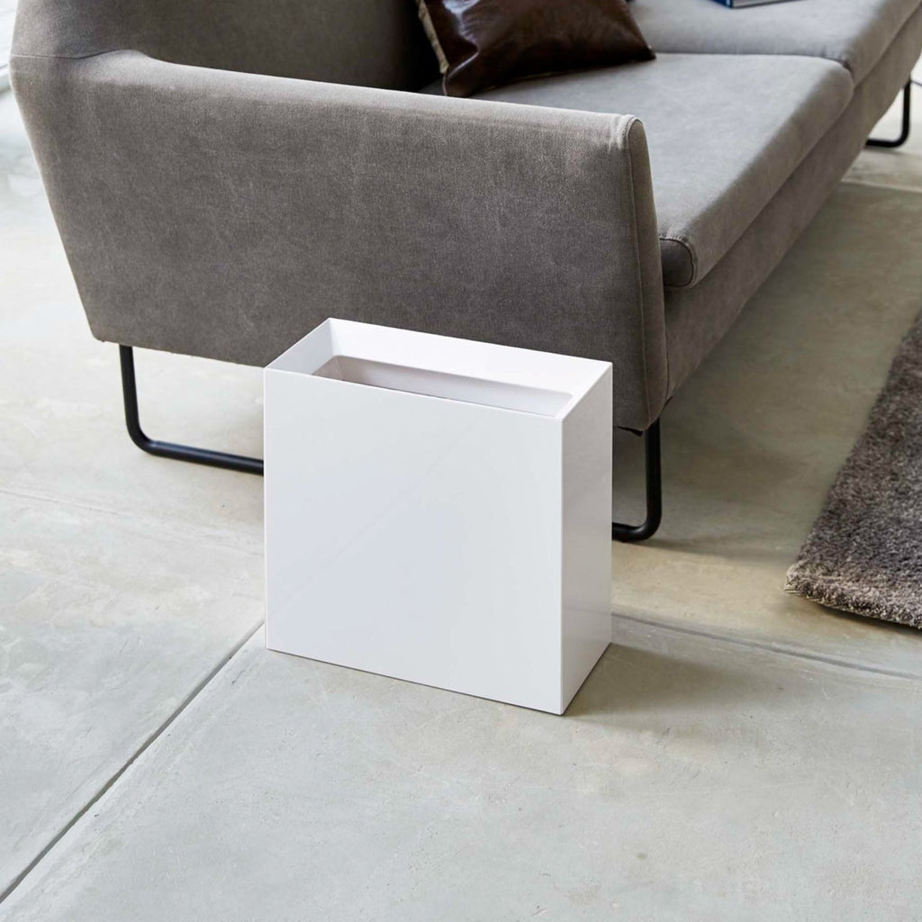 Yamazaki Home Tower Trash Cans offer much more than meets the eye. The slanted opening was integrated to hide unsightly trash within. An interlocking design pins your trash bag in place while simultaneously hiding the unattractive bin liner. 