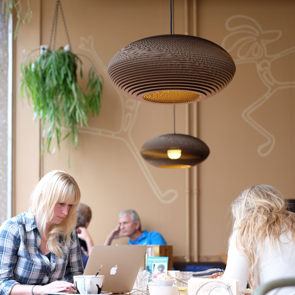 Handcrafted from recycled cardboard, Graypants flagship Scraplights provide warm, intimate, and functional lighting for any occasion or space. Tough and elegant, each is precision cut with a laser and assembled by hand using non-toxic adhesive, and all Scraplights are treated with a non-toxic fire retardant.