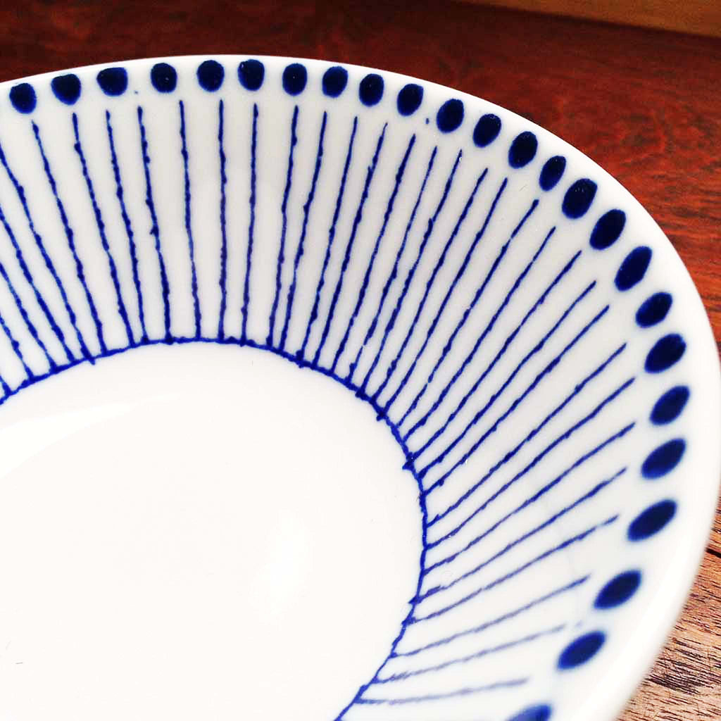 Tokusa grows in rushes with reed-like bodies segmented with ridges similar to bamboo, and they have beautiful bluish tones at their ends represented by the blue dots.  Sou Tokusa Blue and White Dinnerware Collection.