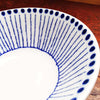 Tokusa grows in rushes with reed-like bodies segmented with ridges similar to bamboo, and they have beautiful bluish tones at their ends represented by the blue dots.  Sou Tokusa Blue and White Dinnerware Collection.