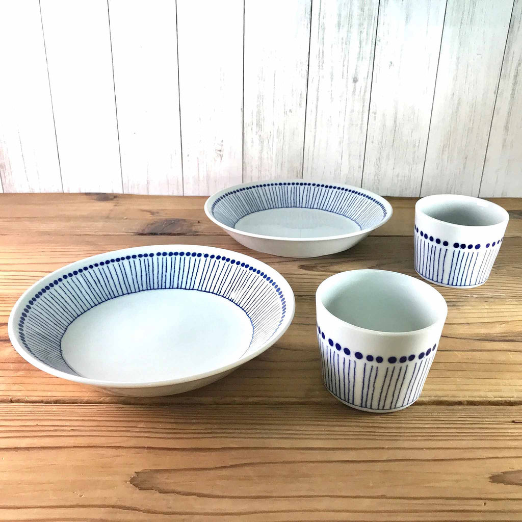 The wonderful, deep-set embossment of this collection represents tokusa, or Japanese "ten-grass." Tokusa grows in rushes with reed-like bodies segmented with ridges similar to bamboo, and they have beautiful bluish tones at their ends represented by the blue dots. 