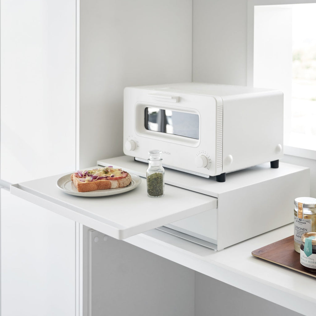 Easy-access pull-out shelf. Reversible-use pull-out shelf above or below. The vanishing pull-out shelf also provides ample space to perch a mug while you perfect your morning beverage or rest that bowl of leftovers you just microwaved so you can season it up before carrying it to the table. 