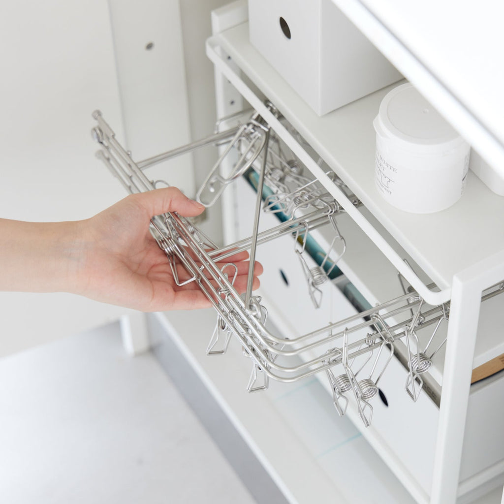 This three-tier steel kitchen storage rack is your helpful aid for cabinet organization! Adjust the bottom two shelves as you wish to store baking sheets, electric burners, pots and pans, and other bulky kitchen appliances that are otherwise hard to store. 