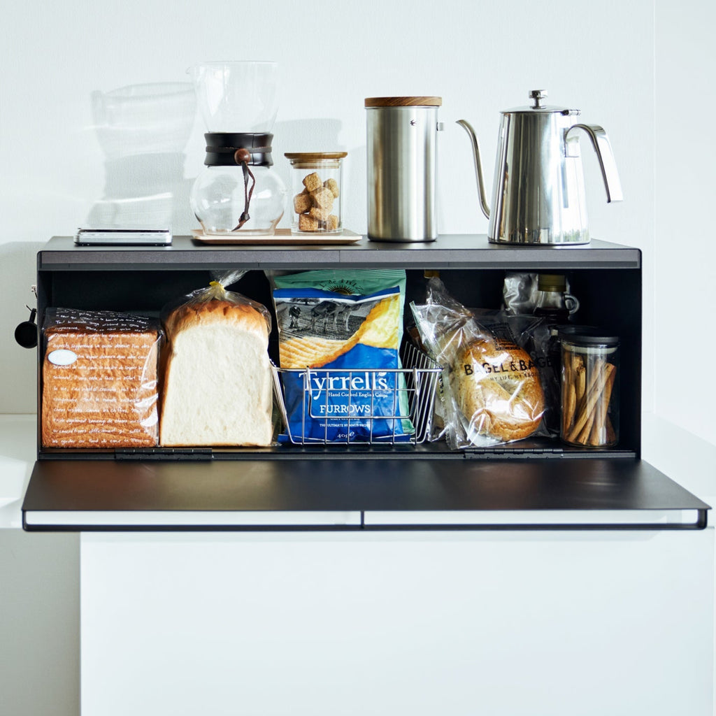 This luxuriously wide bread box not only keeps your favorite loaves and pastry treats fresh and delicious, but also clears countertop clutter by storing fruit preserves, nut butters, teas, and more.