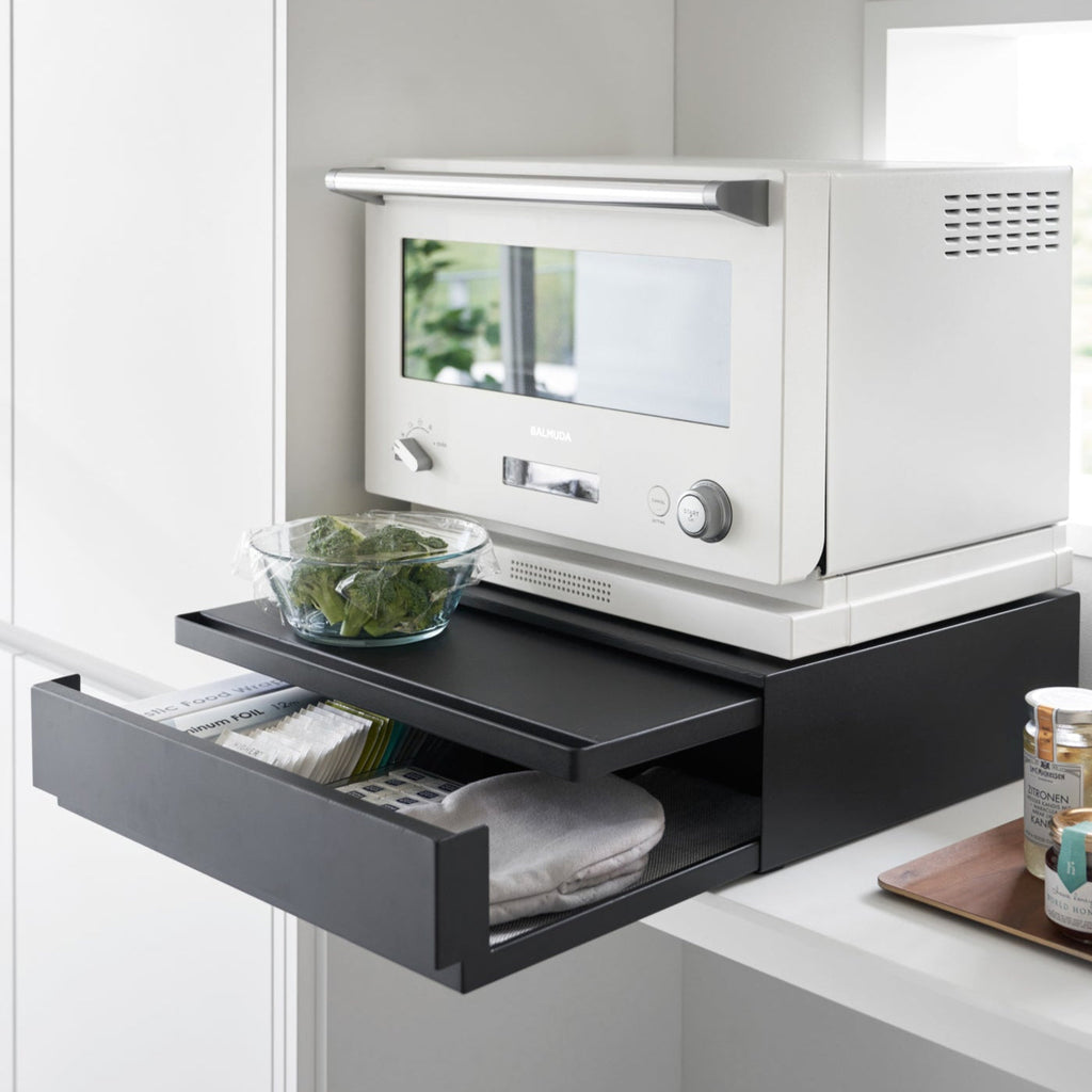 Place larger items on top and enjoy a whole extra drawer of storage for dish towels, potholders, tea trinkets—you name it! 
