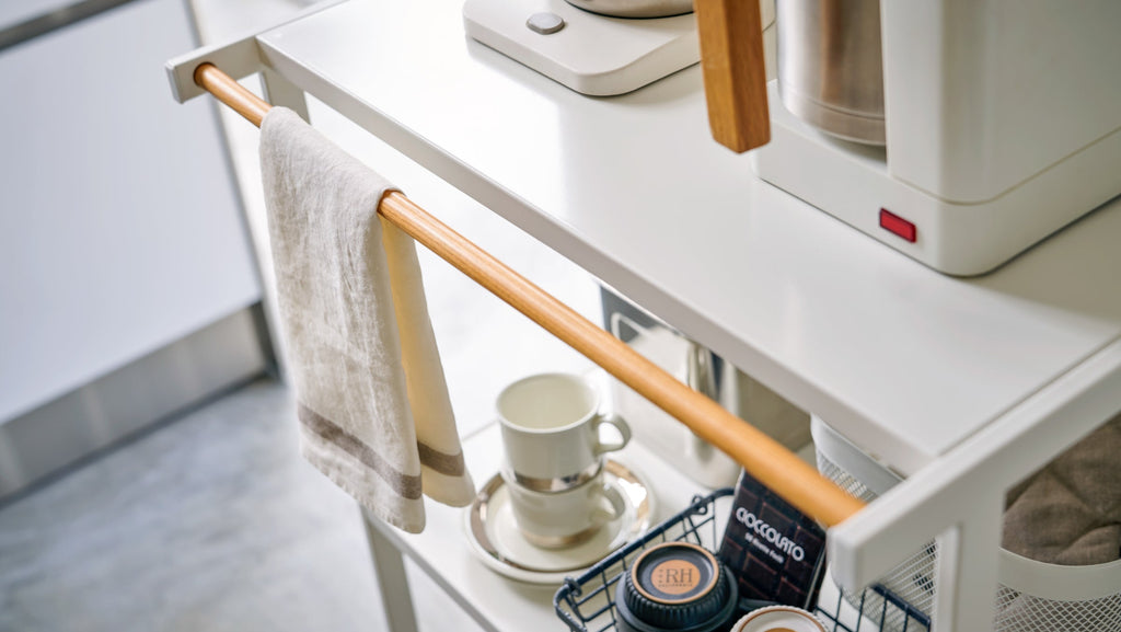 The organizer is made of steel with an accent of lacquer coated natural wood, making it as beautiful as it is sturdy. The shelves can hold 17.6 lbs each, hanger bar 6.6 lbs, and hooks 1.1 lbs each.