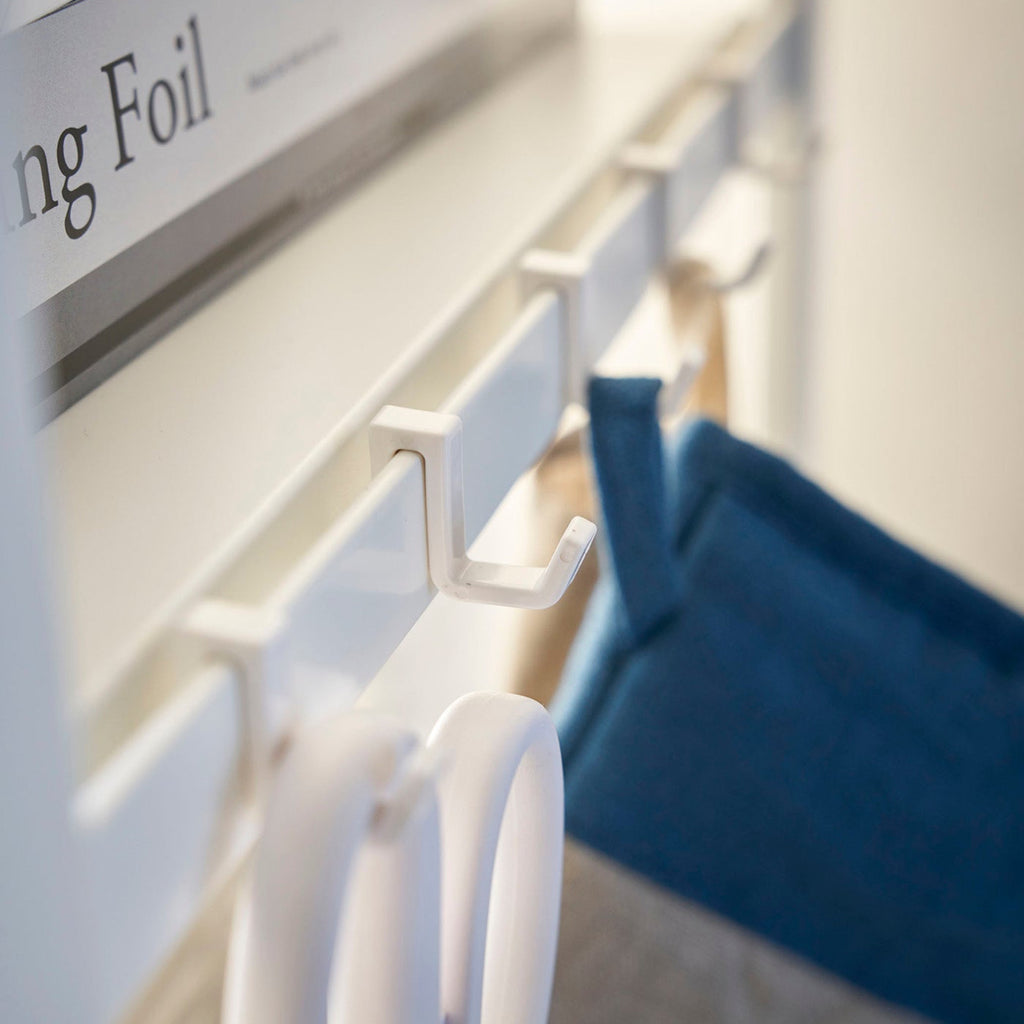 This kitchen appliance storage rack creates a dedicated space in the kitchen for your mid-sized appliances such as toaster ovens, microwaves, and blenders. The bottom compartment accommodates small refrigerators and garbage cans.