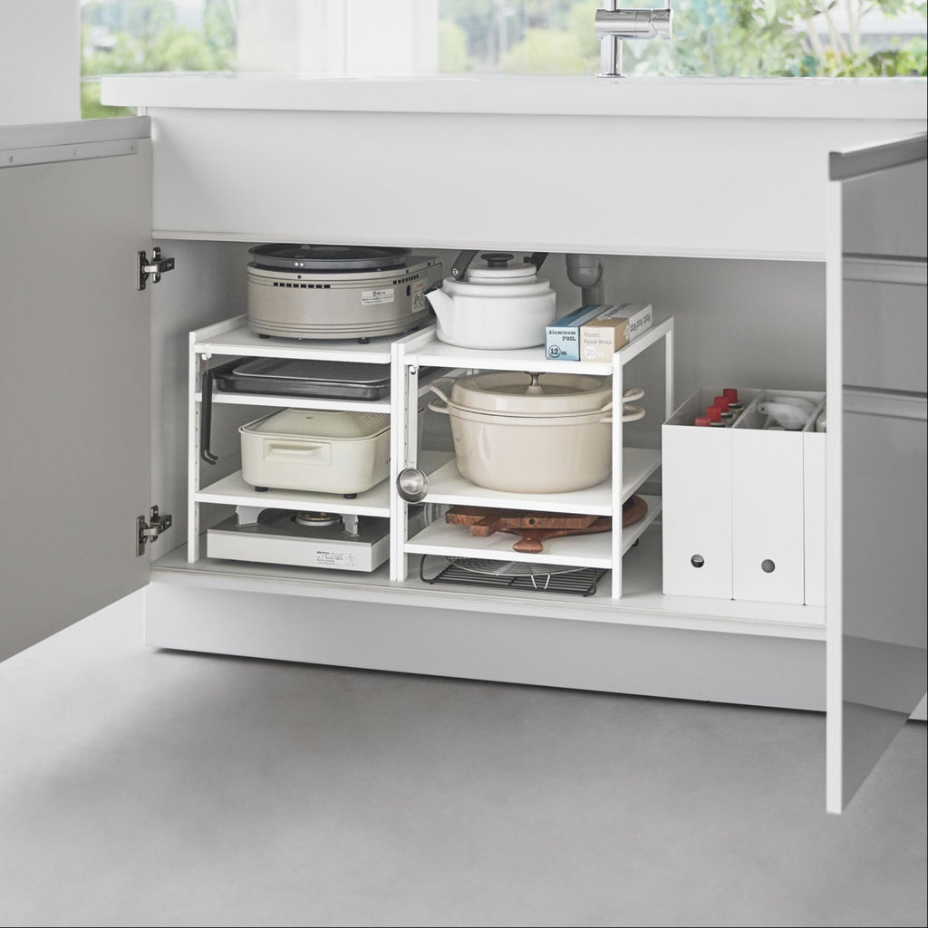 This three-tier steel kitchen storage rack is your helpful aid for cabinet organization! Adjust the bottom two shelves as you wish to store baking sheets, electric burners, pots and pans, and other bulky kitchen appliances that are otherwise hard to store. An effective solution to keep your cleaning tools in check under the kitchen sink, and even bathroom cabinets.