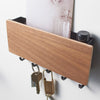 Five hooks for hanging keys, keychains, fobs, or masks across the bottom of this entryway organizer. Tuck mail, sunglasses, sunscreen, or anything else you don't want to forget as you leave home into the upper compartment.