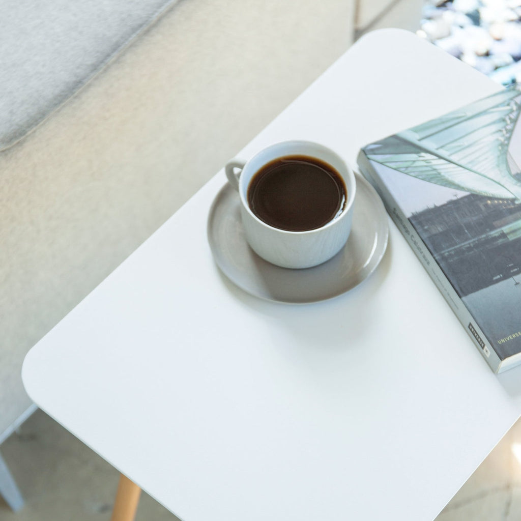 Wipe clean with a soft, damp cloth, and wipe dry. Avoid harsh materials. Use warm water and mild soap, if necessary. Dry immediately. Continued exposure to liquids can cause stains on Plain Side table surface. Recommend using coasters when placing drinks on the table.