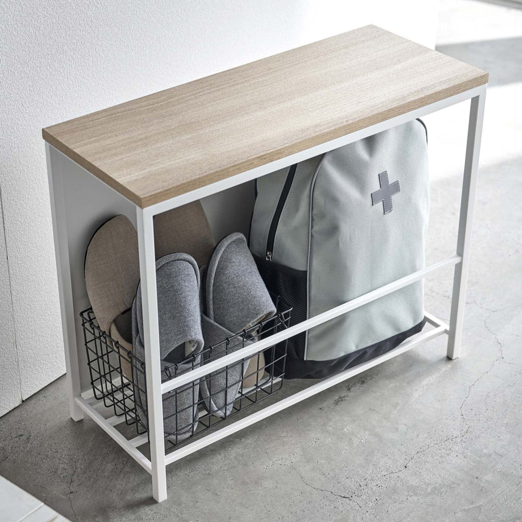 If you’re struggling to find a place for some of your bulkier entryway items, this stylish organizer and entryway bench is for you. A front panel neatly conceals slippers, outdoor toys, or any other entryway clutter while keeping them within reach.