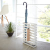 Yamazaki Home Brick Rectangle White Umbrella Stand. SKU 2360. Keep long umbrellas upright in the non-slip holder while looping hand umbrellas on top rungs.