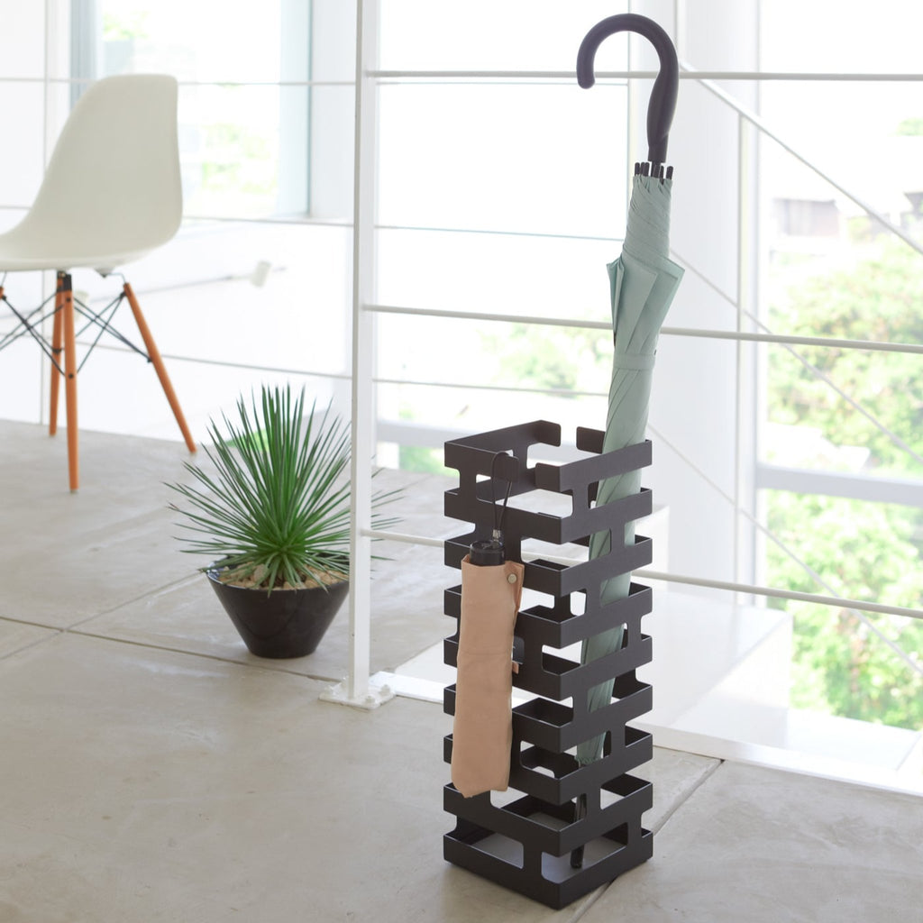Yamazaki Home Brick Square Black Umbrella Stand. SKU 2363. Lay the foundation for a modern, inviting entryway. This brickwork-inspired umbrella stand offers both eye-catching design and functionality. 
