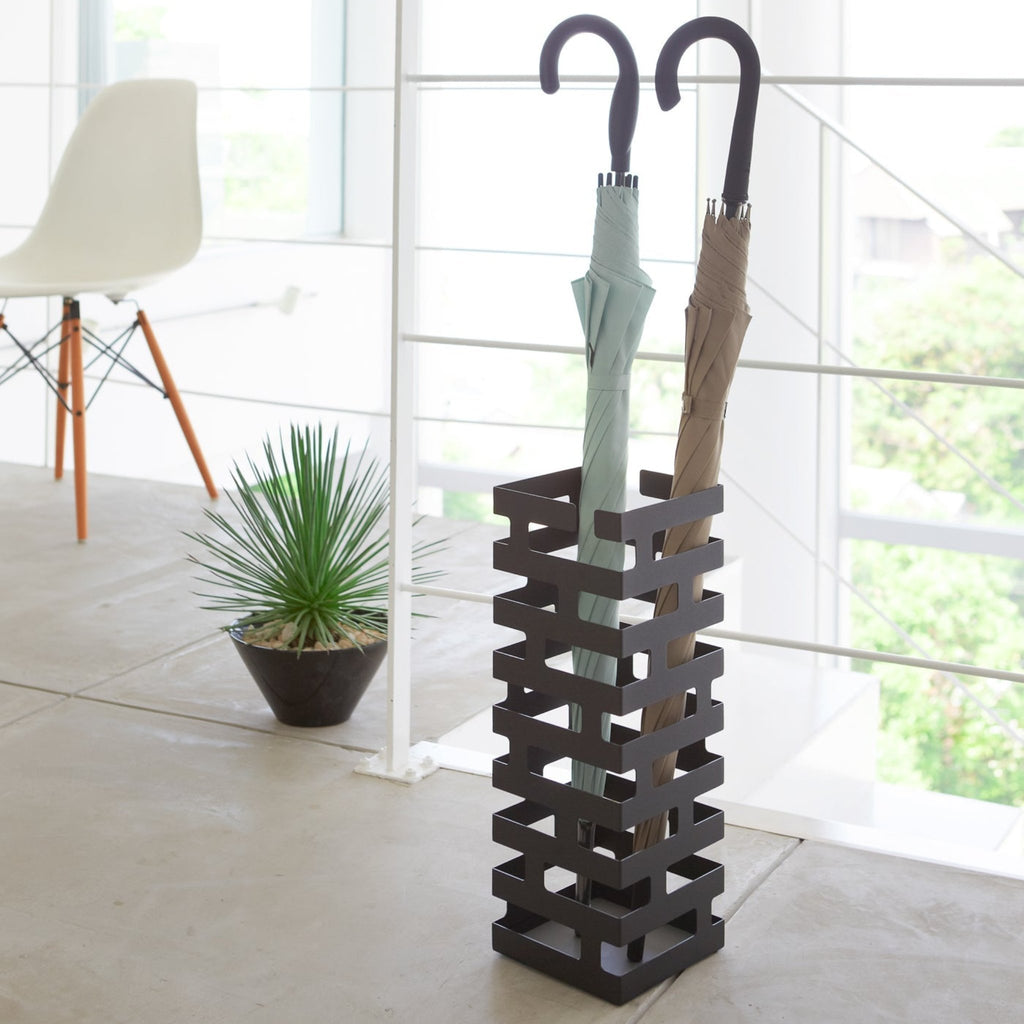 Yamazaki Home Brick Square Black Umbrella Stand. SKU 2363. Keep long umbrellas upright in the non-slip holder while looping hand umbrellas on top rungs.