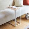 C-shaped table will wrap under and over sofas where the top of the seat cushions are no more than 19.5" from the ground.