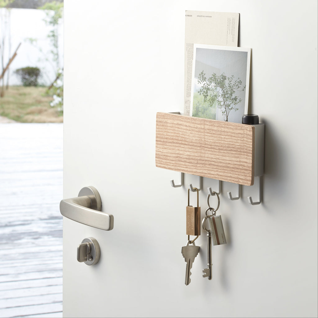 Hang keys, masks, and more on the hooks, and keep mail and essentials in the upper compartment. 