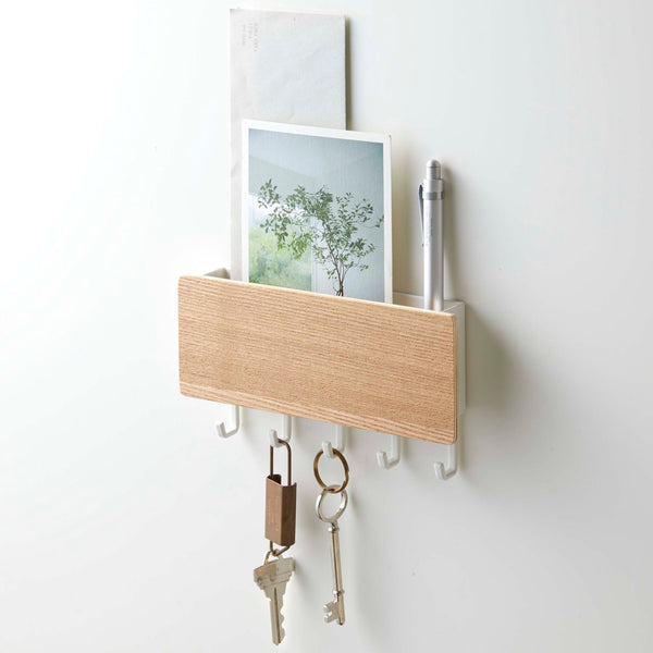 Elevate your entryway with the stylish Yamazaki Home Rin Steel Wood Magnetic Key Rack. 