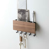 Time to upgrade from the catch-all bowl in your entryway! Five hooks for hanging keys, keychains, fobs, or masks across the bottom of this entryway organizer. Tuck mail, sunglasses, sunscreen, or anything else you don't want to forget as you leave home into the upper compartment.