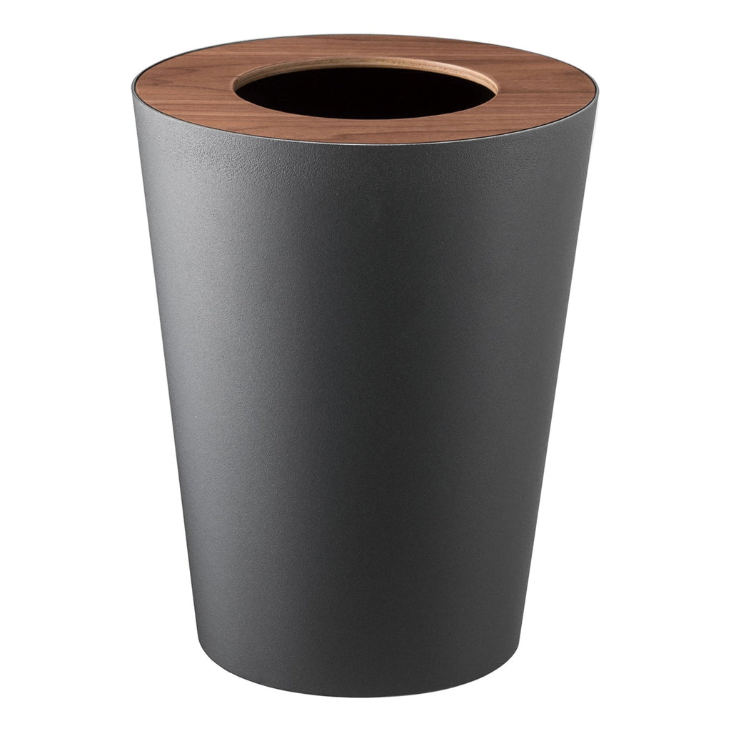 Is your home riddled with ugly plastic trash cans? Bin them and try these classy and modern waste baskets. The wooden lid adds a charming accent while also secretly hiding the waste within! An inner ring holds a bin liner in place discreetly and invisibly. Smart and stylish. Designed in Japan.