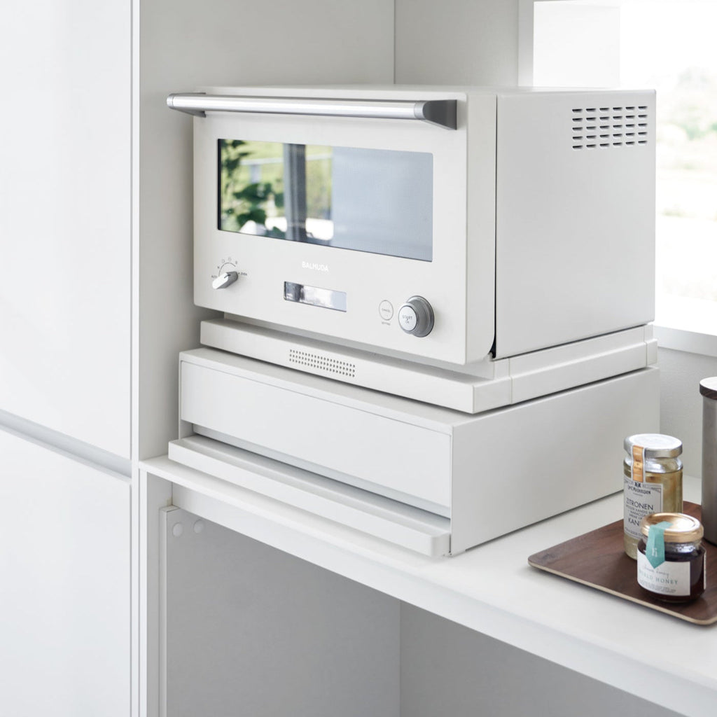 Reclaim the precious countertop space your kitchen appliances are hogging with this unique two-way drawer.