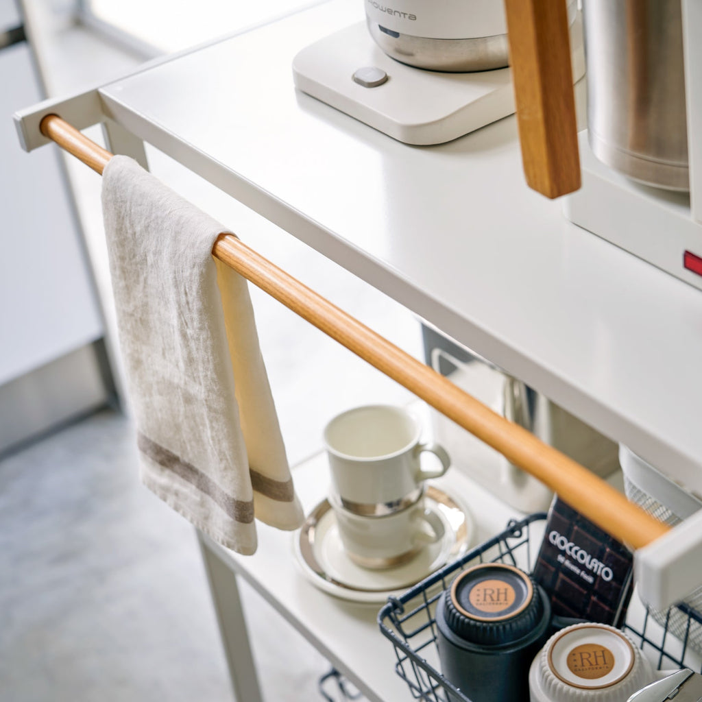 The organizer is made of steel with an accent of lacquer coated natural wood, making it as beautiful as it is sturdy. The shelves can hold 17.6 lbs each, hanger bar 6.6 lbs, and hooks 1.1 lbs each.