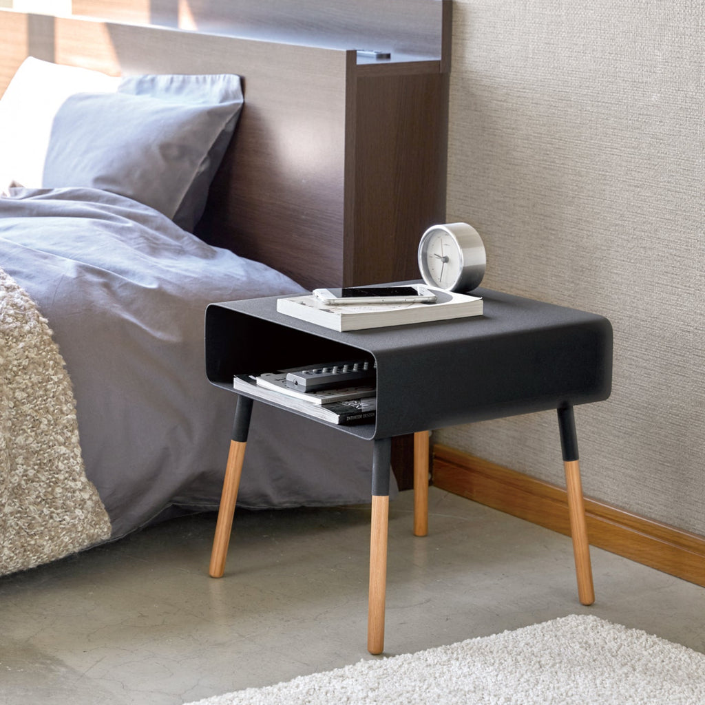 Place beside a couch or bed and marvel at its sleek, more-than-minimal design. The inner shelf is perfect for storing magazines you're thumbing through or the book you can't put down (when you need to put it down).