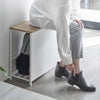 Better yet, it also doubles as a bench so you can easily tie your shoelaces or fasten buckles, as well as provide a convenient perch for your bags and purses when you walk in the door.