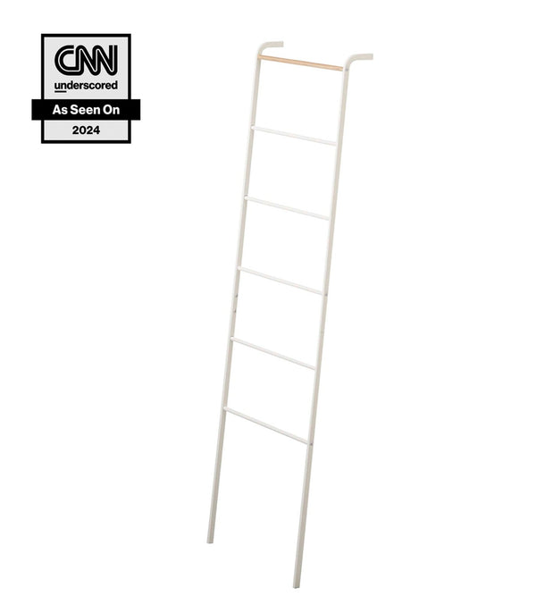 Yamazaki Home Tower Leaning Storage Ladder White SKU 2812. Prop Yamazaki Home Tower Leaning Storage Ladder against a living room wall as a canvas for throw blankets and linens, or in the bedroom for clothes, hats, scarves, and more.