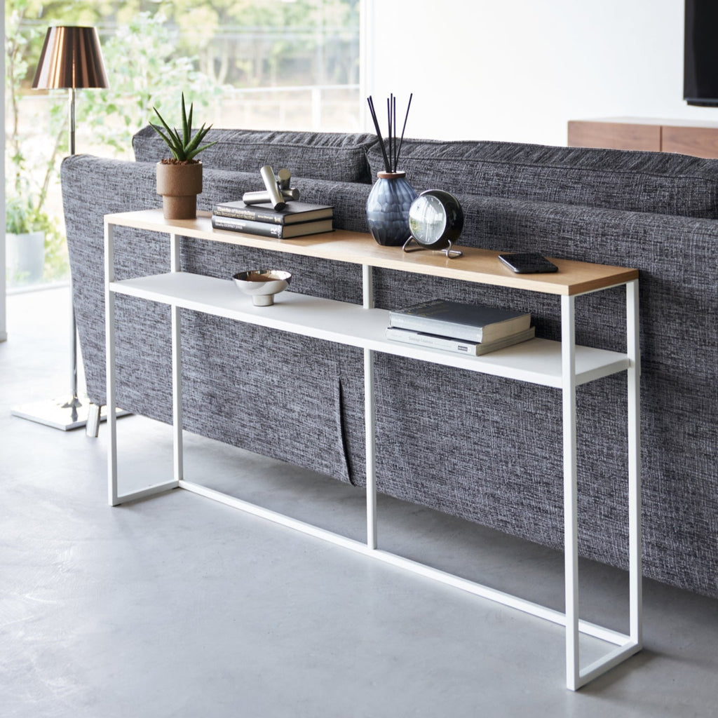 This luxuriously long yet stealthily slim console table will add just the extra storage you need in your entryway or maximize the space behind the couch or sofa. 