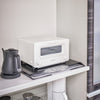 Yamazaki Home Tower Steel Magnetic Placemat Organizer mounts directly to a refrigerator or vertical surface with built-in magnets or use horizontally as a slim riser. 