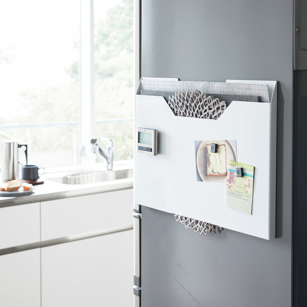 Yamazaki Home Tower Steel Magnetic Placemat Organizer mounts directly to a refrigerator or vertical surface with built-in magnets or use horizontally as a slim riser. 