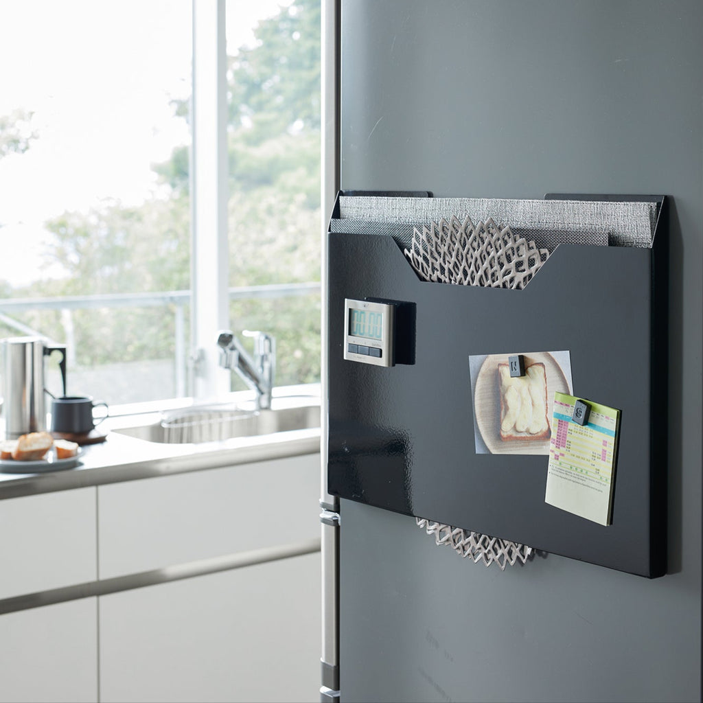 Maximize kitchen space and store placemats neatly. Ensure everything has a home. Placemats start out nice and neat, but can become a floppy mess in the kitchen. 