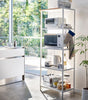 This kitchen appliance storage rack creates a dedicated space in the kitchen for your mid-sized appliances such as toaster ovens, microwaves, and blenders. The bottom compartment accommodates small refrigerators and garbage cans.