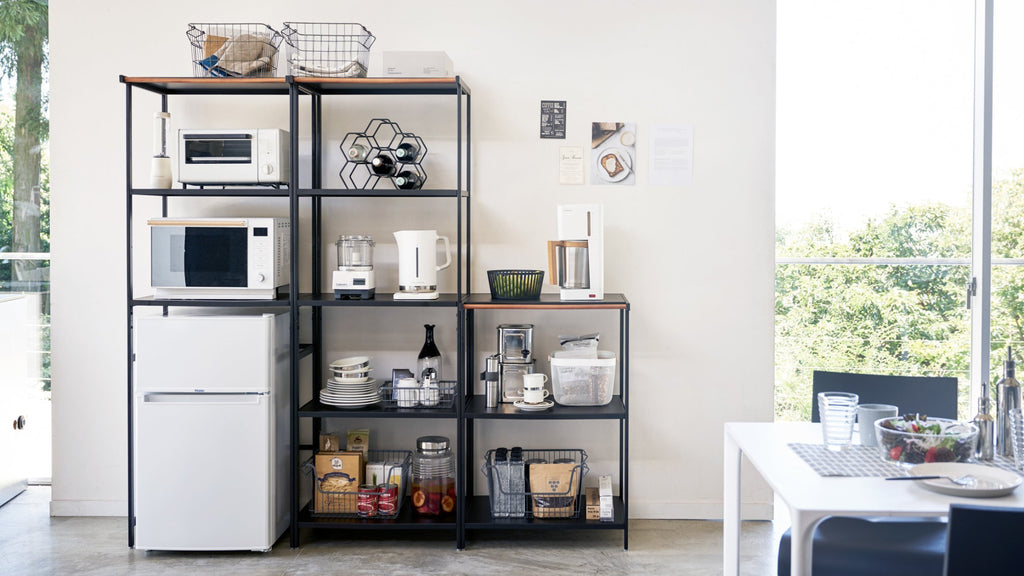 This kitchen appliance storage rack creates a dedicated space in the kitchen for your mid-sized appliances such as toaster ovens, microwaves, and blenders. The bottom compartment accommodates small refrigerators and garbage cans.