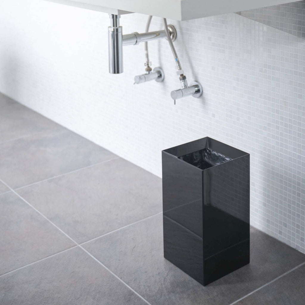 Yamazaki Home Tower Trash Cans offer much more than meets the eye. The slanted opening was integrated to hide unsightly trash within. An interlocking design pins your trash bag in place while simultaneously hiding the unattractive bin liner. 