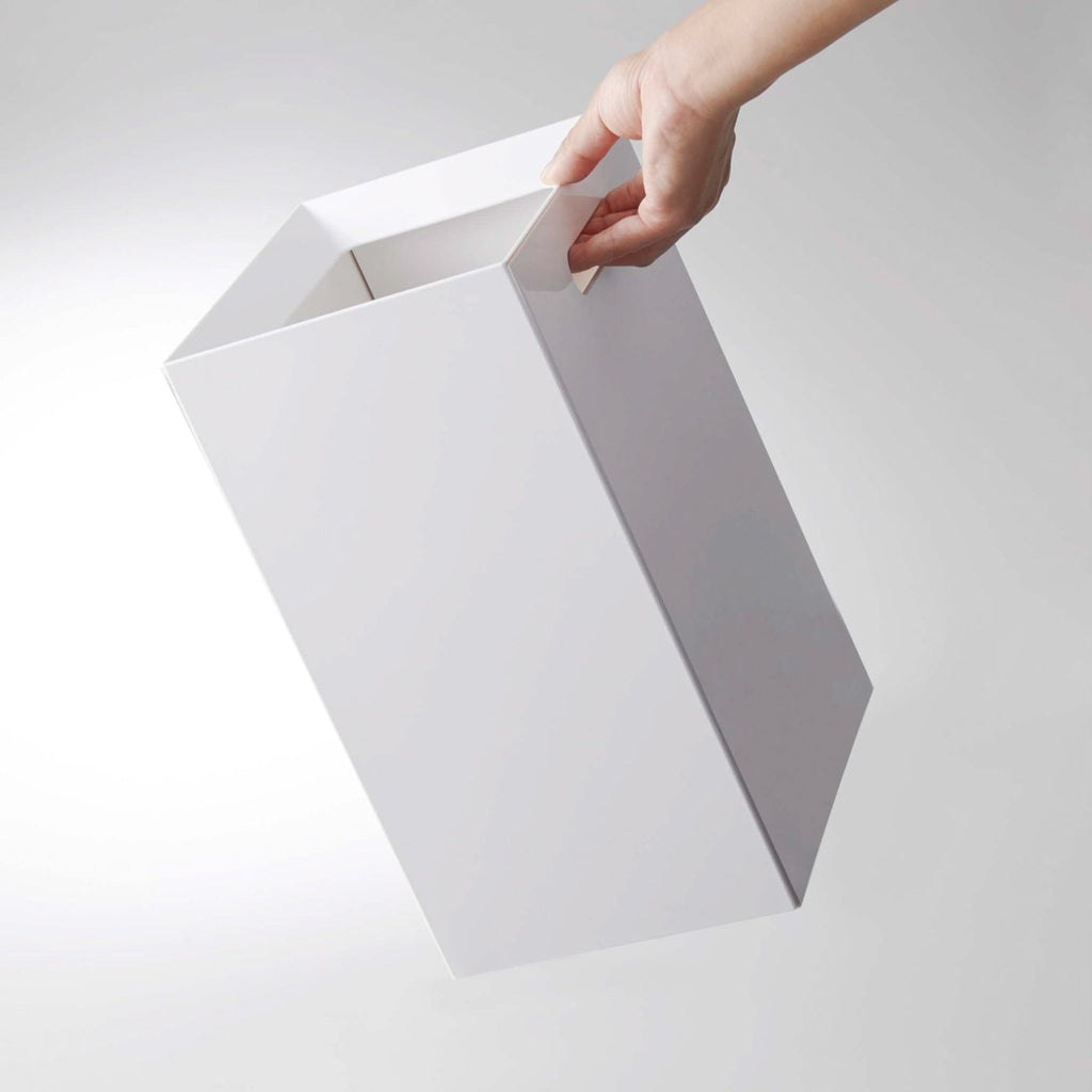Not only will the liner be secure and nearly invisible, but replacing the trash just got even easier thanks to the handle on this waste bin. This wastebasket really did think of everything.
