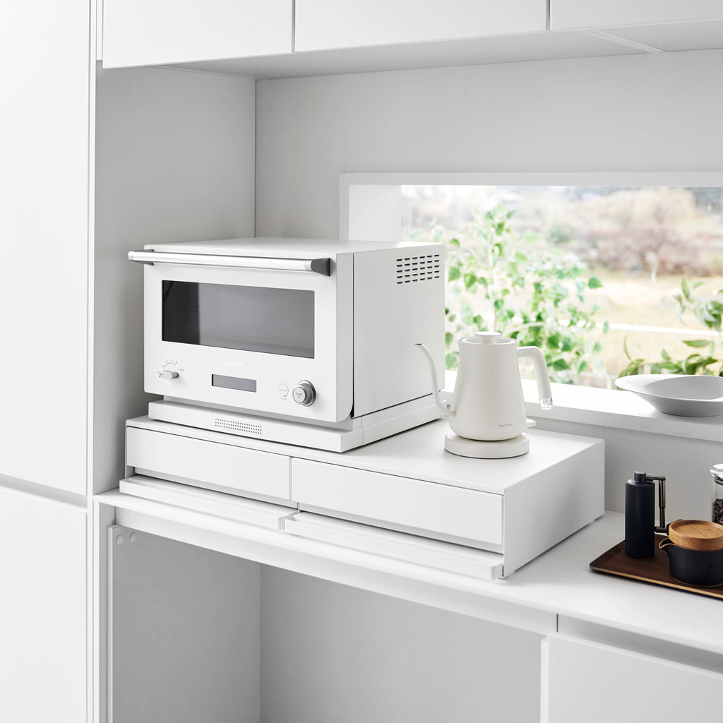 Store up to two mid-size appliances on top. Pull-out shelf can be installed above or below the drawer. Keep kitchen essentials handy and organized.