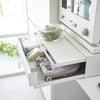 A kitchen drawer, pull-out shelf, and appliance stand in one, this organizer creates space and convenience in the kitchen.