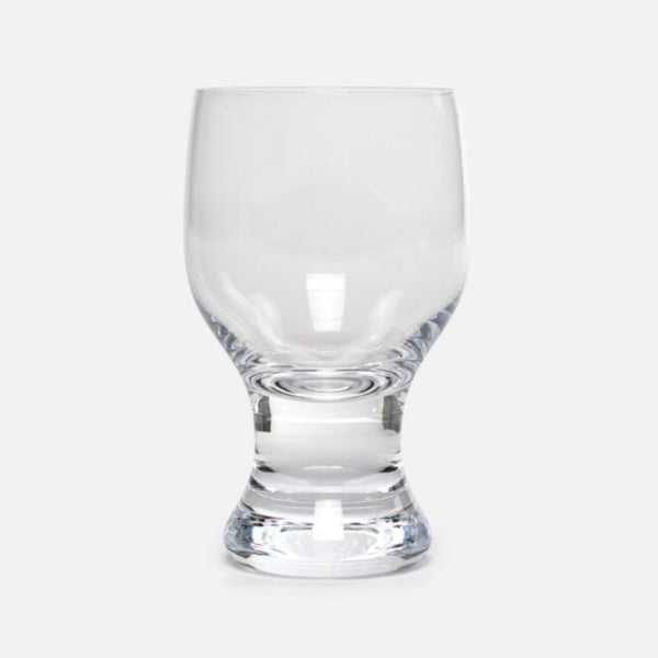 The form's soft flow makes you want to pull the glass closer when you wrap it in your hand. The material reflects the texture of the drink and even the pattern of the table that allows for the interplay of the glass and space.