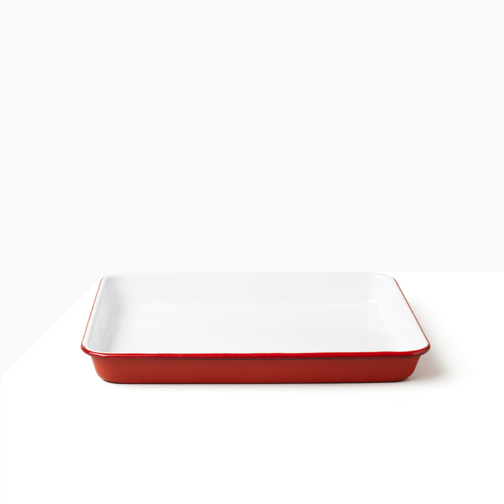 Falcon Enamelware Serving Tray in Pillbox Red. A deep sturdy enamel tray, ideal for loading up with slices of cake and a pot of tea.