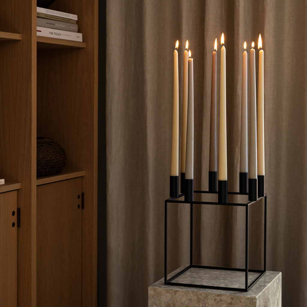 Kubus 8 by Mogens Lassen. SKU: BL10008. With a sharp sense of contemporary Functionalist style, Mogens Lassen designed the iconic Kubus candleholder in 1962, a piece once reserved solely for family and close architect colleagues. 