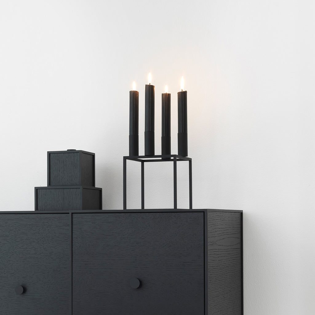 Kubus 4 by Mogens Lassen. SKU: BL10204. With a sharp sense of contemporary Functionalist style, Mogens Lassen designed the iconic Kubus candleholder in 1962, a piece once reserved solely for family and close architect colleagues. The Kubus is still crafted in Denmark, and among architects and design connoisseurs it has achieved the status of a modern international design icon.