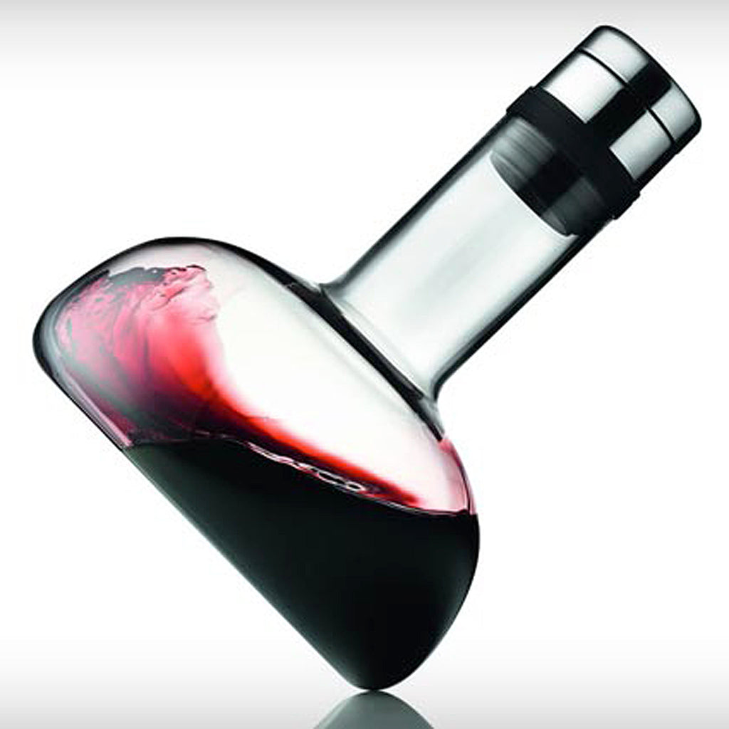 The actual aeration process is untraditional and worth seeing, so your guests will probably enjoy witnessing the wine breather in action. Place the bottle on the table and attach the carafe to the bottleneck. Then, carefully turn the bottle over and allow the wine to flow into the carafe. The wine breather spreads the wine so that it splashes through the neck of the carafe and flows down its sides, providing the maximum possible surface area.