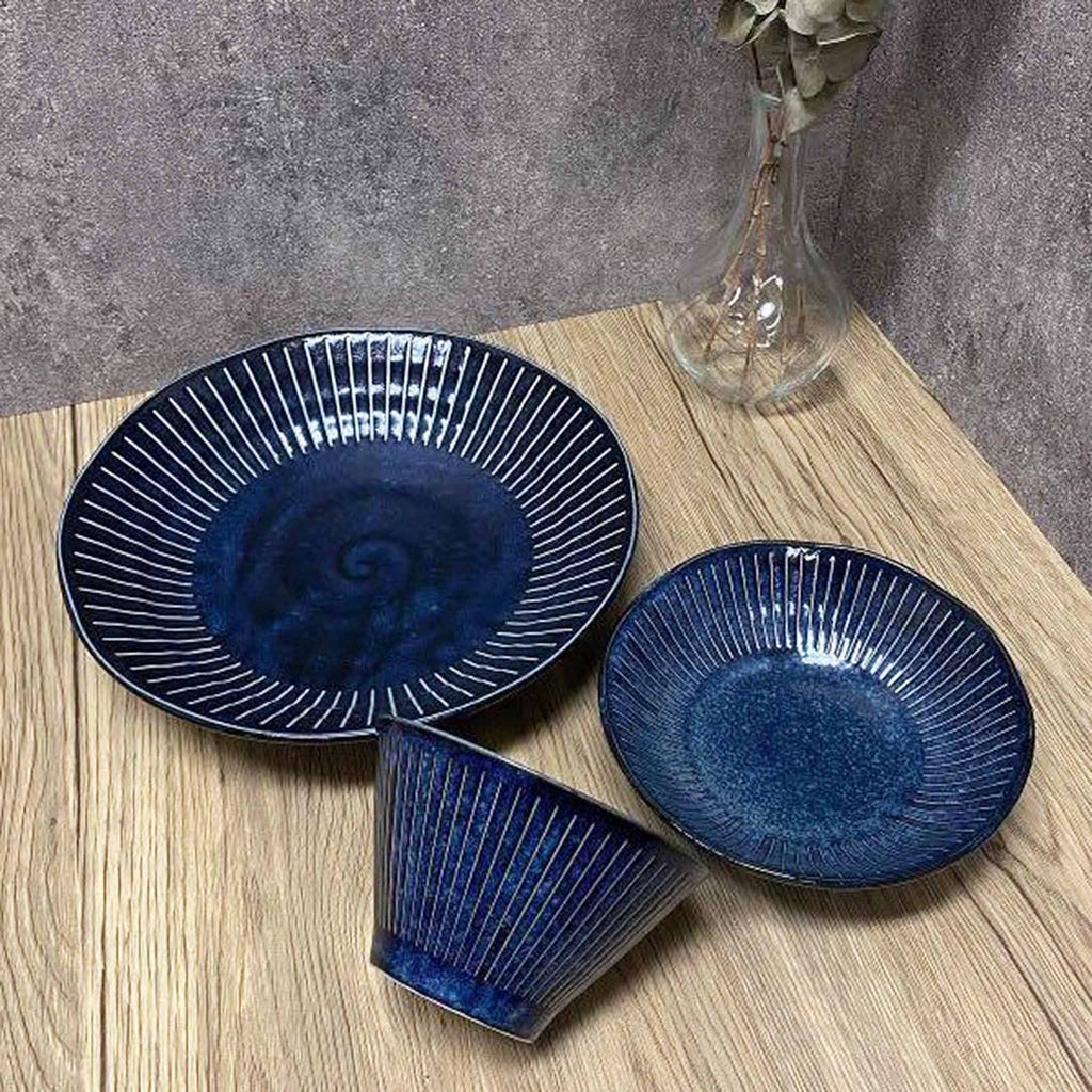 Beautiful deep color of Blue Namako Tokusa collection brings elegance to any table. The indigo color is inspired by the deep blue ocean and changes with the light just like the surface of the water. Tokusa is the name of a plant and refers to a pattern of vertical stripes. 