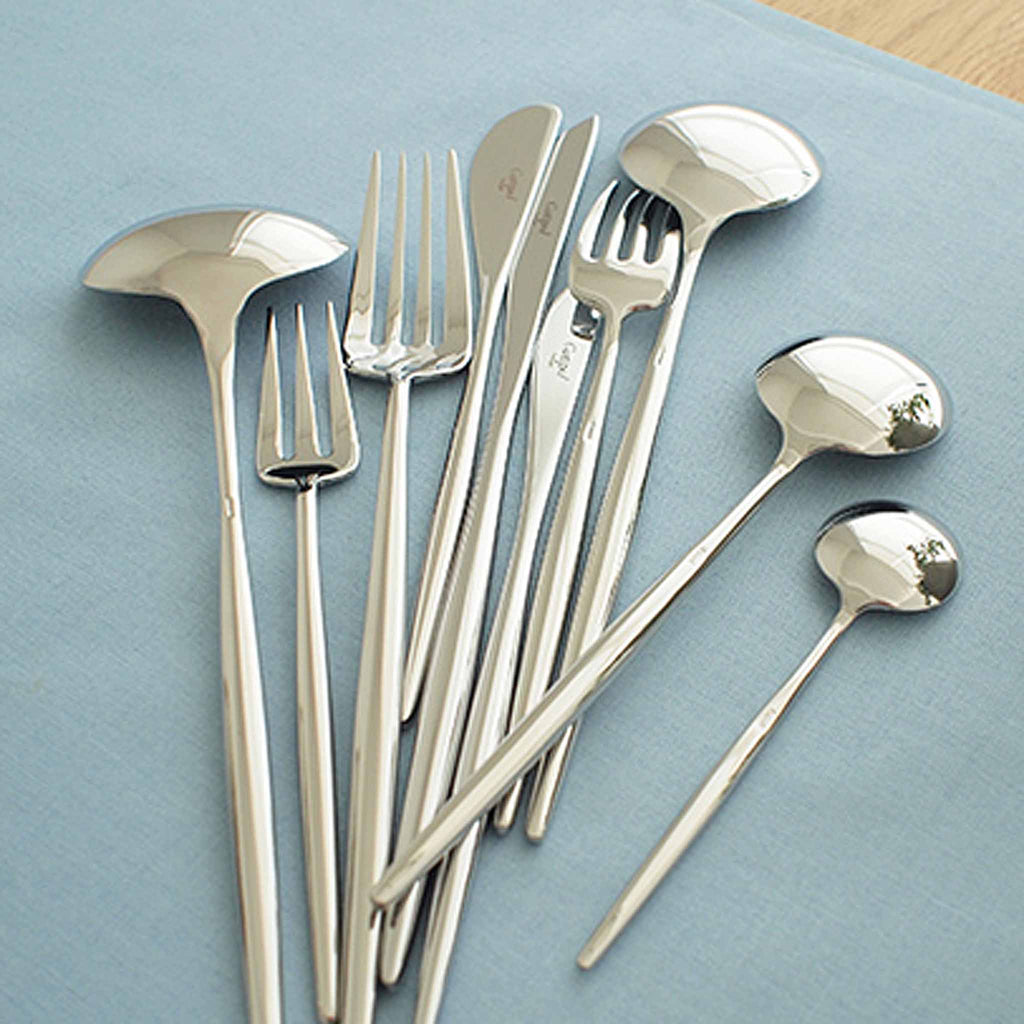 Moon Polished Steel Collection reflects the ergonomic study of the shapes. This collection's long slender handles, distinctive spoons, and feather like knives stand out from ordinary. 