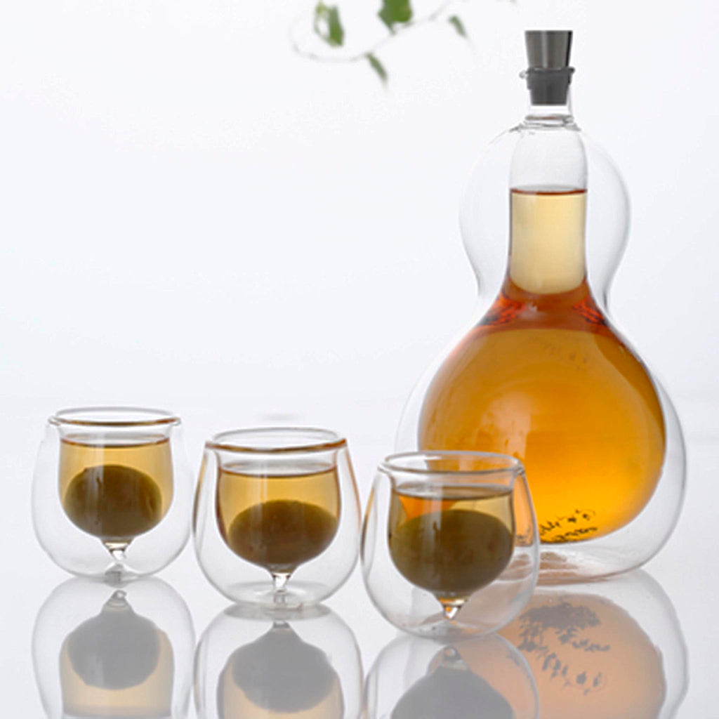 Hulu Liquor Server (540ml - 18.25oz) by JIA Inc. SKU JHL510. The HULU has been used for natural containers since the Chou Dynasty (1066 BC-770 BC). In wedding ceremonies of this period, brides and grooms exchanged drinks from a HULU that was cut into two halves. This ritual symbolized the harmony of yin and yang, while the making of one entity from two parts represented the beginning of the Home for newlyweds. 