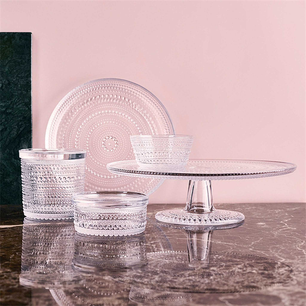 Kastehelmi features rings of delicate glass bubbles designed to resemble strings of dewdrops glistening under the morning sun. Each piece plays with light in a way that truly showcases the reflective beauty of the glass. 