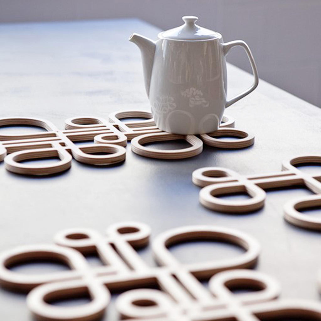 Decorate your table and protect the tablecloth with these trivets made of birch plywood.  They have great heat resistance. 