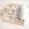 Anne Thomas TOMA Objects INSIDE OUT Model G wood trivet set.